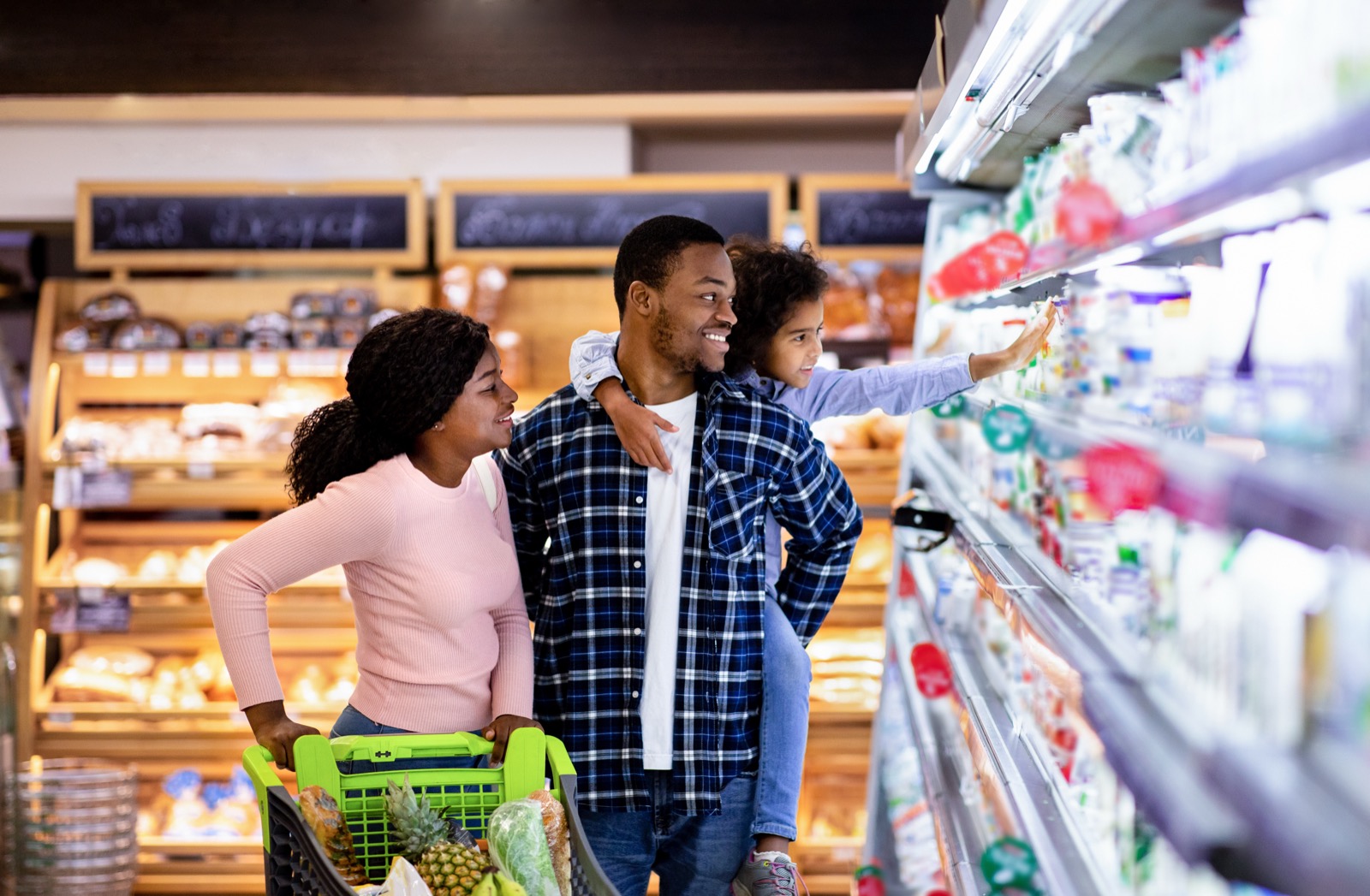 Family shopping together in a grocery store aisle